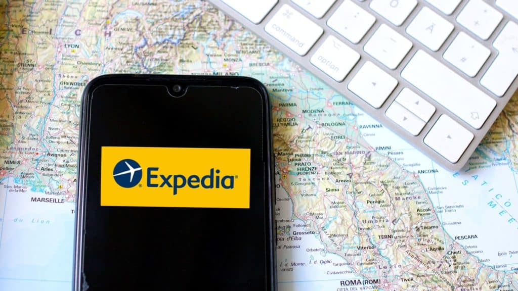 vector graphic showing an illustration of the expedia affiliate program on a phone screen